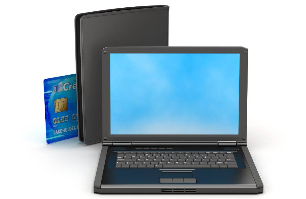 ノートパソコンとクレジットカード、ビジネスケースの3Dイメージ